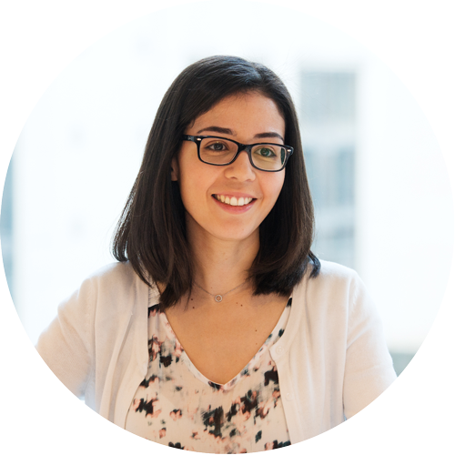 Circular profile photo of Mounia Bouhlal, a woman with dark hair and glasses, smiling in a bright professional setting. She is wearing a white cardigan over a patterned top. Her name appears in text below the image.